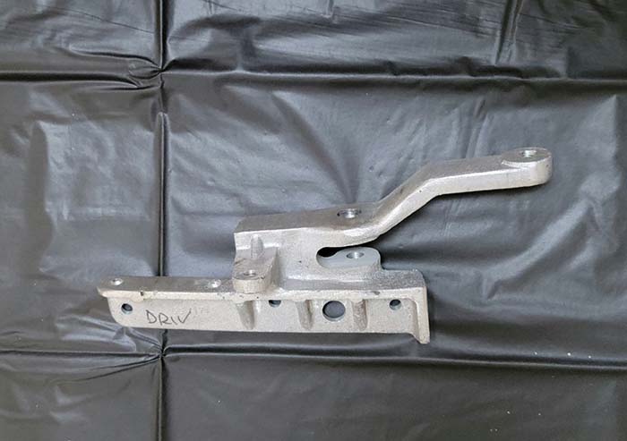 Aluminum casting for the lower end of a top rail